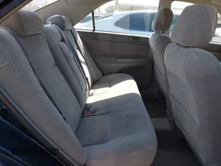 2003 Toyota Camry LE z VIN 4T1BF32K93U050590, wystawiony jako IAAI lot #42300405 z przebiegiem 146 510 mil mil oraz . Historia ofert i sprzedaży dostępna na DreamBid. Obrazek 8.