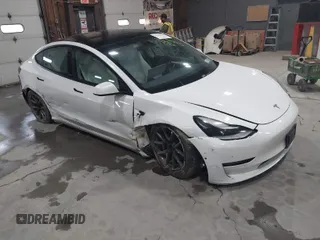 2021 Tesla Model 3 Long Range with VIN 5YJ3E1EBXMF051060, listed as a IAAI auction lot 41958018 with 65,631 mi miles. Bid and sale history available at carsss.com. Image 1.