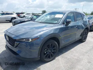 2024 Mazda CX-5 S Carbon Edition z VIN JM3KFBCLXR0521353, wystawiony jako IAAI lot #42351444 z przebiegiem 17 270 mil mil oraz . Historia ofert i sprzedaży dostępna na DreamBid. Obrazek 2.