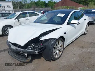2021 Tesla Model S Long Range with VIN 5YJSA1E57MF428512, listed as a IAAI auction lot 42511020 with 29,611 mi miles and . Bid and sale history available at DreamBid. Image 2.