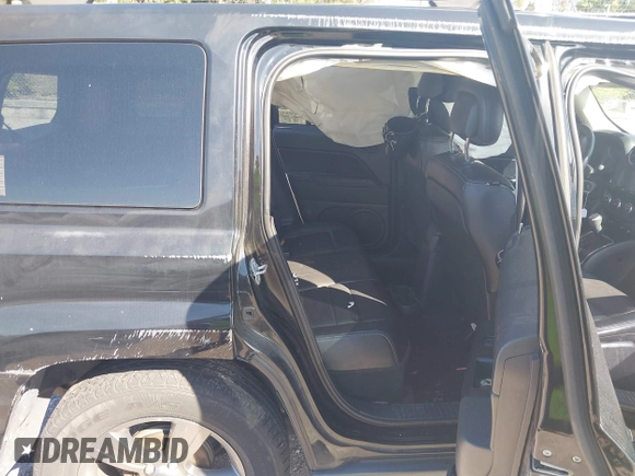 2014 Jeep Patriot Latitude with VIN 1C4NJPFA6ED680773, listed as a IAAI auction lot 41569916 with 135,590 mi miles and . Bid and sale history available at carsss.com. Image 8.