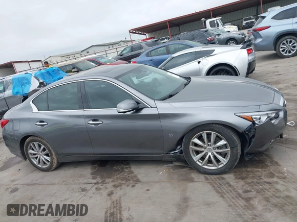 2015 Infiniti Q50 Premium z VIN JN1BV7AR7FM408015, wystawiony jako IAAI lot #42083301 z przebiegiem 58 817 mil mil oraz . Historia ofert i sprzedaży dostępna na DreamBid. Obrazek 13.