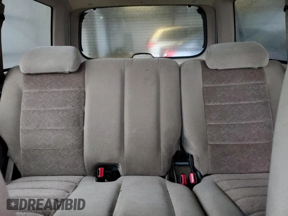 2000 Ford Explorer XLT z VIN 1FMZU73E2YZB82279, wystawiony jako Copart lot #86607864 z przebiegiem 46 620 mil mil oraz Szkody całkowita. Historia ofert i sprzedaży dostępna na DreamBid. Obrazek 10.