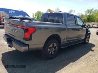 2022 Ford F-150 Lightning Pro z VIN 1FT6W1EV7NWG10033, wystawiony jako Copart lot #55569895 z przebiegiem 11 282 mil mil oraz Szkody całkowita. Historia ofert i sprzedaży dostępna na DreamBid. Obrazek 3.