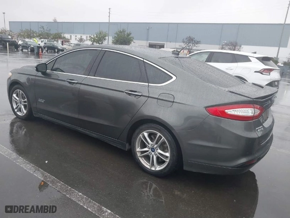 2015 Ford Fusion Energi Titanium with VIN 3FA6P0SU2FR173958, listed as a IAAI auction lot 41504220 with 170,235 mi miles. Bid and sale history available at carsss.com. Image 3.