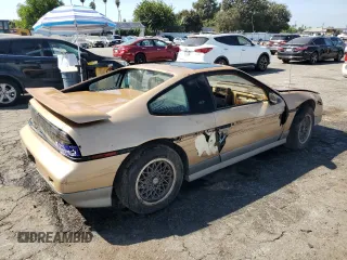 1987 Pontiac Fiero GT z VIN 1G2PG1194HP216891, wystawiony jako Copart lot #72103234 z przebiegiem 55 013 mil mil oraz Tytuł czysty. Historia ofert i sprzedaży dostępna na DreamBid. Obrazek 3.