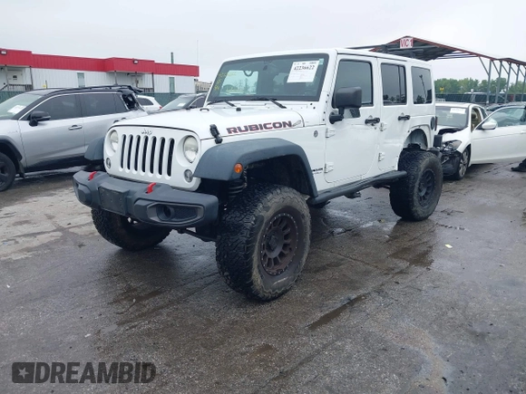 2014 Jeep Wrangler Unlimited Rubicon with VIN 1C4HJWFG4EL104827, listed as a IAAI auction lot 42236622 with 90,935 mi miles and . Bid and sale history available at DreamBid. Image 2.