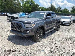 2021 Toyota Tacoma SR with VIN 5TFCZ5AN5MX265228, listed as a Copart auction lot 61986885 with 84,181 mi miles and Salvage title. Bid and sale history available at DreamBid. Image 1.