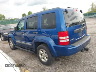 2010 Jeep Liberty Sport z VIN 1J4PN2GK4AW180109, wystawiony jako IAAI lot #42155603 z przebiegiem 158 514 mil mil oraz . Historia ofert i sprzedaży dostępna na DreamBid. Obrazek 3.