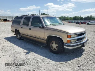 1999 Chevrolet Suburban with VIN 3GNEC16R6XG205408, listed as a Copart auction lot 57169415 with 303,412 mi miles and Salvage title. Bid and sale history available at DreamBid. Image 4.
