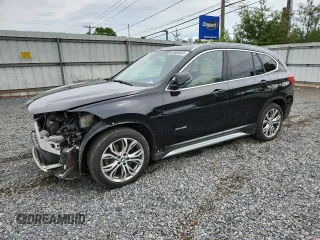 2017 BMW X1 xDrive28i with VIN WBXHT3C32H5F75352, listed as a Copart auction lot 63658455 with 64,127 mi miles and Salvage title. Bid and sale history available at DreamBid. Image 1.