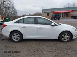 2014 Chevrolet Cruze 1LT z VIN 1G1PC5SB1E7264742, wystawiony jako IAAI lot #41740704 z przebiegiem 155 005 mil mil oraz . Historia ofert i sprzedaży dostępna na DreamBid. Obrazek 14.