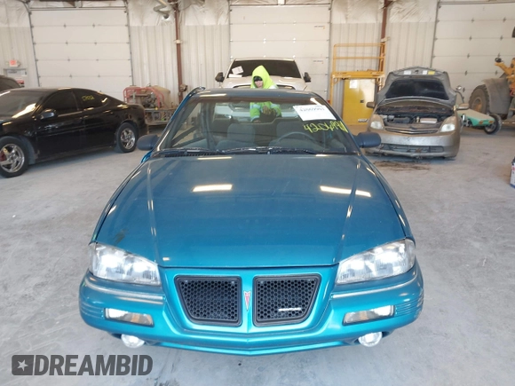 1994 Pontiac Grand Am z VIN 1G2NE15M5RM500643, wystawiony jako IAAI lot #42069901 z przebiegiem 77 129 mil mil oraz . Historia ofert i sprzedaży dostępna na DreamBid. Obrazek 12.