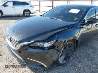 2016 Mazda 6 i Grand Touring with VIN JM1GJ1W50G1478699, listed as a IAAI auction lot 41711211 with 208,720 mi miles and . Bid and sale history available at DreamBid. Image 18.