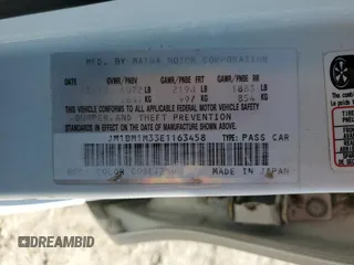 2014 Mazda 3 S Grand Touring z VIN JM1BM1M33E1163458, wystawiony jako Copart lot #52093725 z przebiegiem 141 757 mil mil oraz Szkoda całkowita • Salvage title. Historia ofert i sprzedaży dostępna na DreamBid. Obrazek 13.