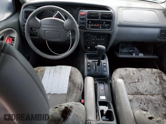 2002 Chevrolet Tracker LT with VIN 2CNBE634126928532, listed as a Copart auction lot 76990704 with Not provided miles and Salvage title. Bid and sale history available at DreamBid. Image 8.