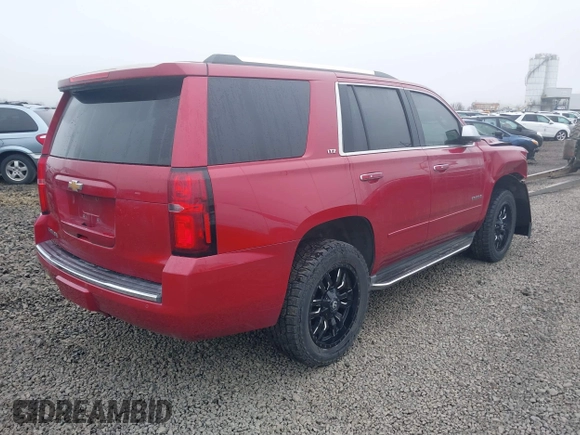 2015 Chevrolet Tahoe LTZ z VIN 1GNSKCKC6FR276531, wystawiony jako IAAI lot #41692617 z przebiegiem 124 010 mil mil oraz . Historia ofert i sprzedaży dostępna na DreamBid. Obrazek 4.