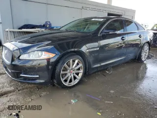 2015 Jaguar XJ with VIN SAJWA1CZXF8V81218, listed as a Copart auction lot 76613434 with 56,549 mi miles and Salvage Title. Bid and sale history available at carsss.com. Image 1.