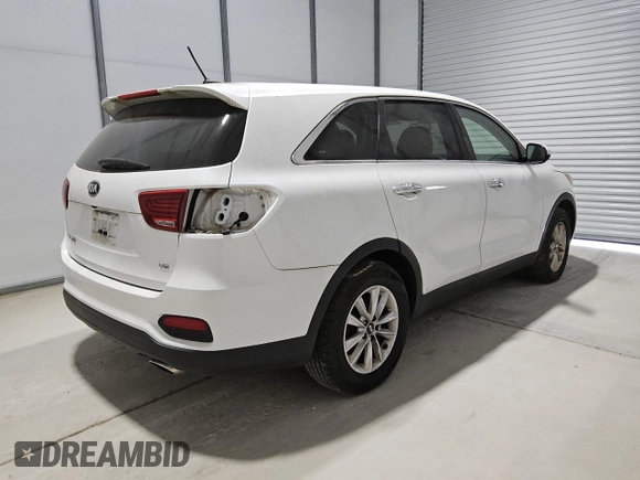 2019 Kia Sorento LX z VIN 5XYPG4A54KG482528, wystawiony jako Copart lot #55098735 z przebiegiem 128 821 mil mil oraz Czysty tytuł • Clean title. Historia ofert i sprzedaży dostępna na DreamBid. Obrazek 3.