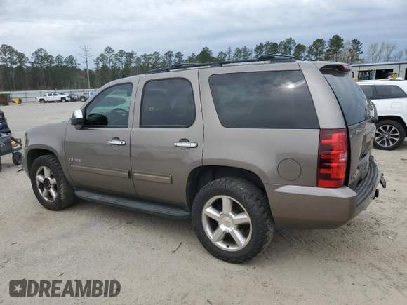 2011 Chevrolet Tahoe LS with VIN 1GNSCAE09BR138852, listed as a Copart auction lot 49165595 with 207,548 mi miles and Salvage title. Bid and sale history available at DreamBid. Image 2.