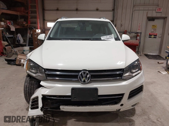 2011 Volkswagen Touareg Sport with VIN WVGFF9BP8BD004747, listed as a IAAI auction lot 41780515 with 159,228 mi miles and . Bid and sale history available at DreamBid. Image 12.
