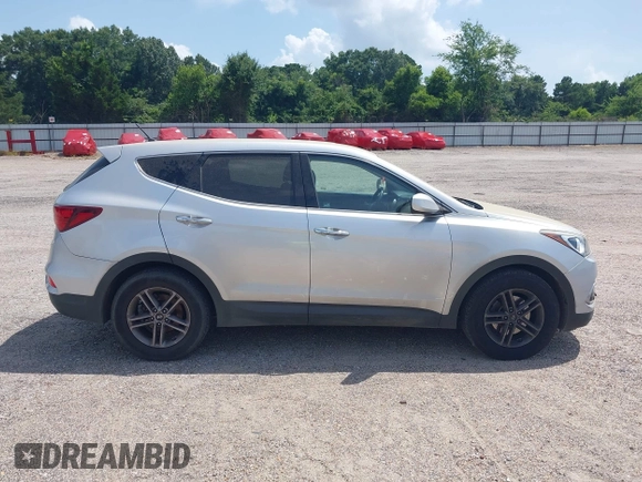 2018 Hyundai Santa Fe 2.4L with VIN 5XYZT3LB4JG557373, listed as a IAAI auction lot 42511741 with 142,572 mi miles and . Bid and sale history available at DreamBid. Image 14.