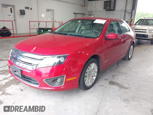 2012 Ford Fusion Hybrid с VIN 3FADP0L34CR176501, выставлен на аукционе IAAI как лот 42239687 с пробегом 86 648 миль миль и . История ставок и продаж доступна на DreamBid. Изображение 2.