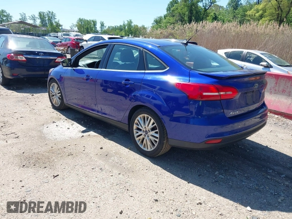 2015 Ford Focus Titanium with VIN 1FADP3J20FL304828, listed as a IAAI auction lot 42144101 with 199,715 mi miles and . Bid and sale history available at carsss.com. Image 3.