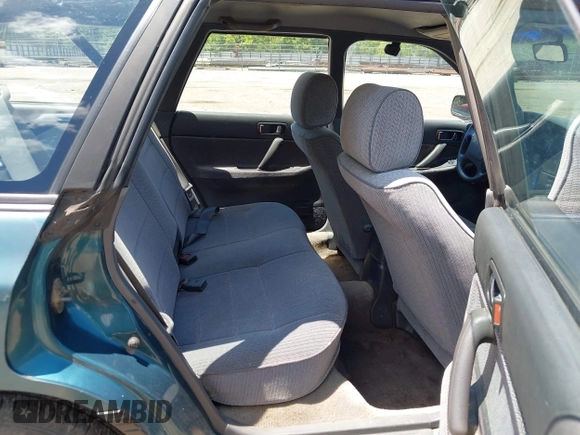 1994 Subaru Legacy L with VIN 4S3BJ6331R7955439, listed as a IAAI auction lot 42770190 with 304,248 mi miles and . Bid and sale history available at DreamBid. Image 8.