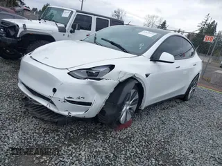2023 Tesla Model Y Long Range with VIN 7SAYGDEE7PF809164, listed as a IAAI auction lot 41828974 with 31,772 mi miles. Bid and sale history available at carsss.com. Image 19.