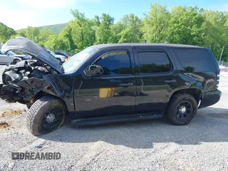 2013 Chevrolet Tahoe Commercial with VIN 1GNLC2E00DR265941, listed as a IAAI auction lot 42289977 with 206,840 mi miles and . Bid and sale history available at DreamBid. Image 13.