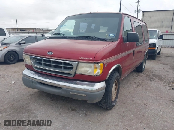 1999 Ford Econoline Cargo with VIN 1FDRE14W0XHB06565, listed as a IAAI auction lot 41496511 with 165,268 mi miles. Bid and sale history available at carsss.com. Image 2.