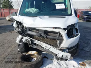 2021 Ford Transit Cargo z VIN 1FTBR3X82MKA18067, wystawiony jako IAAI lot #41205233 z przebiegiem 48 391 mil mil oraz . Historia ofert i sprzedaży dostępna na DreamBid. Obrazek 6.