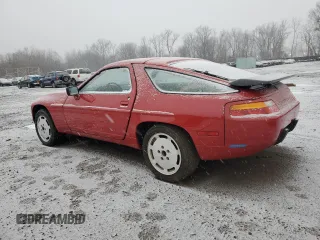 1987 Porsche 928 z VIN WP0JB0926HS860519, wystawiony jako Copart lot #84757504 z przebiegiem 64 737 mil mil oraz Szkody całkowita. Historia ofert i sprzedaży dostępna na DreamBid. Obrazek 2.