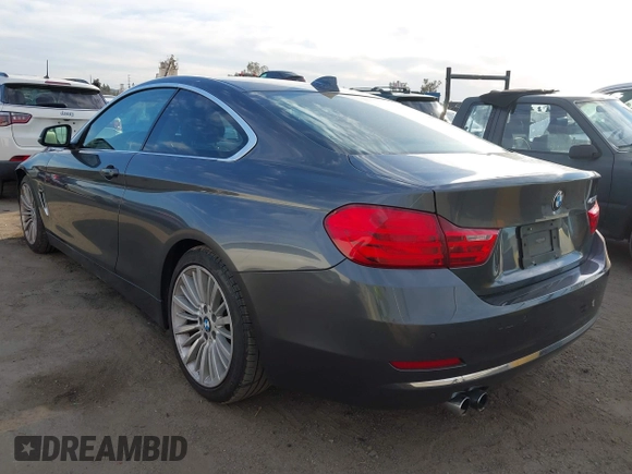 2014 BMW 4 Series 428i with VIN WBA3N7C5XEF719384, listed as a IAAI auction lot 41694678 with 115,517 mi miles and . Bid and sale history available at carsss.com. Image 3.