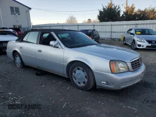 2002 Cadillac DeVille DHS z VIN 1G6KE57Y02U304933, wystawiony jako Copart lot #86919134 z przebiegiem Nie podano mil oraz Czysty tytuł • Clean title. Historia ofert i sprzedaży dostępna na DreamBid. Obrazek 4.
