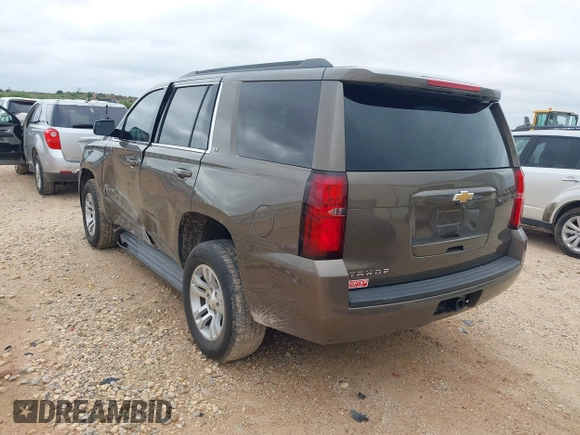 2015 Chevrolet Tahoe LT z VIN 1GNSCBKC2FR685780, wystawiony jako IAAI lot #42354130 z przebiegiem 101 617 mil mil oraz . Historia ofert i sprzedaży dostępna na DreamBid. Obrazek 3.