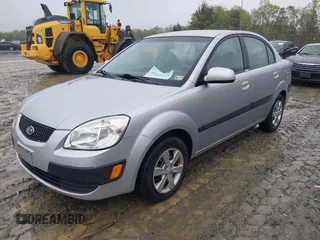 2009 Kia Rio SX with VIN KNADE223596538965, listed as a IAAI auction lot 42029409 with 143,794 mi miles. Bid and sale history available at carsss.com. Image 2.
