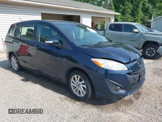 2015 Mazda 5 Sport z VIN JM1CW2BL9F0187973, wystawiony jako IAAI lot #42378711 z przebiegiem 97 543 mil mil oraz . Historia ofert i sprzedaży dostępna na DreamBid. Obrazek 1.