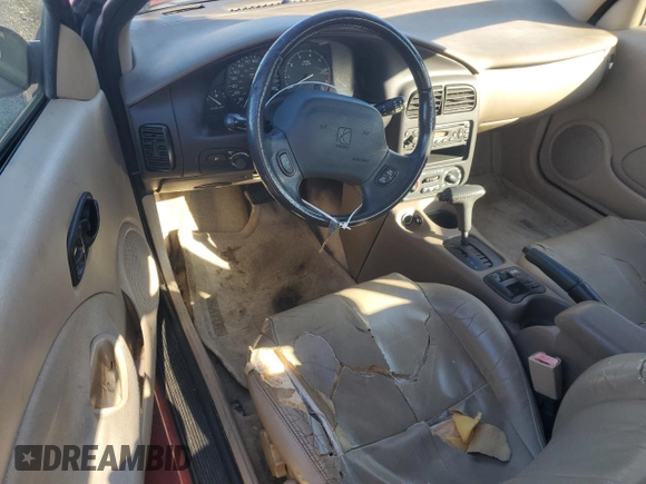 2001 Saturn SC z VIN 1G8ZY12751Z284992, wystawiony jako Copart lot #87116694 z przebiegiem 134 690 mil mil oraz Tytuł czysty. Historia ofert i sprzedaży dostępna na DreamBid. Obrazek 8.