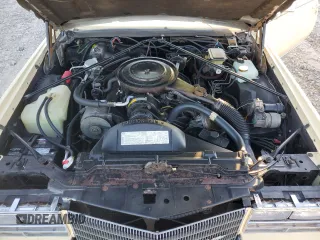 1985 Cadillac Eldorado z VIN 1G6EL5781FE647818, wystawiony jako Copart lot #77608224 z przebiegiem 7192 mil mil oraz Tytuł czysty. Historia ofert i sprzedaży dostępna na DreamBid. Obrazek 11.