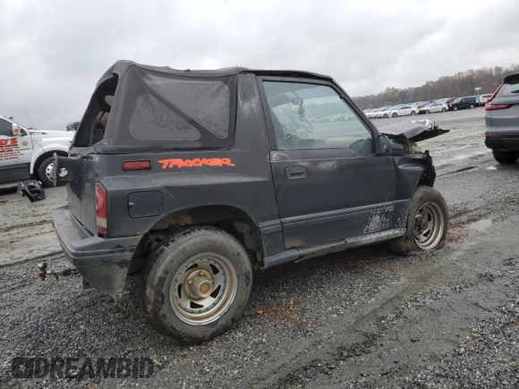 1992 Geo Tracker z VIN 2CNBJ18U8N6938728, wystawiony jako Copart lot #79459914 z przebiegiem 17 751 mil mil oraz Szkody całkowita. Historia ofert i sprzedaży dostępna na DreamBid. Obrazek 3.