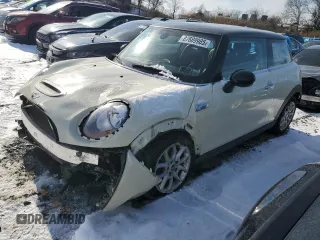 2014 MINI Hardtop S with VIN WMWXM7C51ET987715, listed as a Copart auction lot 87689985 with 129,295 mi miles and Salvage Title. Bid and sale history available at DreamBid. Image 1.