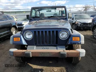 2000 Jeep Wrangler Sport with VIN 1J4FA49S2YP803165, listed as a Copart auction lot 85611904 with 192,427 mi miles and Non repairable. Bid and sale history available at DreamBid. Image 5.