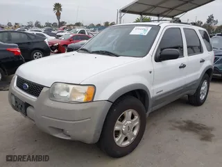 2001 Ford Escape XLT with VIN 1FMYU03121KB61138, listed as a IAAI auction lot 42044869 with 164,698 mi miles. Bid and sale history available at carsss.com. Image 2.