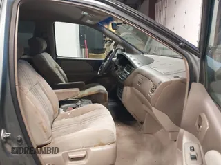 1999 Toyota Sienna CE with VIN 4T3GF19C5XU139787, listed as a IAAI auction lot 41167781 with 217,715 mi miles. Bid and sale history available at carsss.com. Image 5.