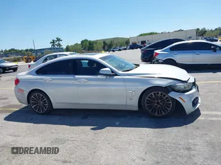 2015 BMW 4 Series 428i with VIN WBA4A5C58FGK15335, listed as a IAAI auction lot 41723243 with 152,652 mi miles and . Bid and sale history available at DreamBid. Image 12.