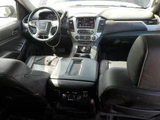 2015 GMC Yukon SLT with VIN 1GKS2BKC6FR145140, listed as a Copart auction lot 55451365 with 216,522 mi miles and Salvage Title. Bid and sale history available at DreamBid. Image 8.