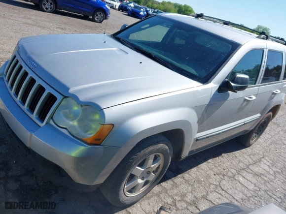 2009 Jeep Grand Cherokee Laredo with VIN 1J8GS48K99C528145, listed as a IAAI auction lot 42077024 with 167,588 mi miles. Bid and sale history available at carsss.com. Image 2.