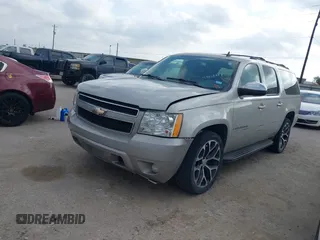 2009 Chevrolet Suburban LT w/2LT with VIN 1GNFC26039R234735, listed as a IAAI auction lot 42068617 with 263,534 mi miles. Bid and sale history available at carsss.com. Image 2.